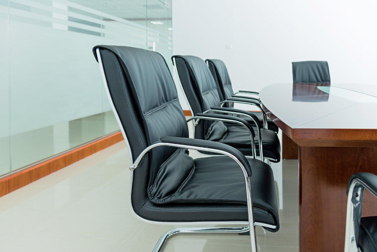 Leather office chairs in conference room.