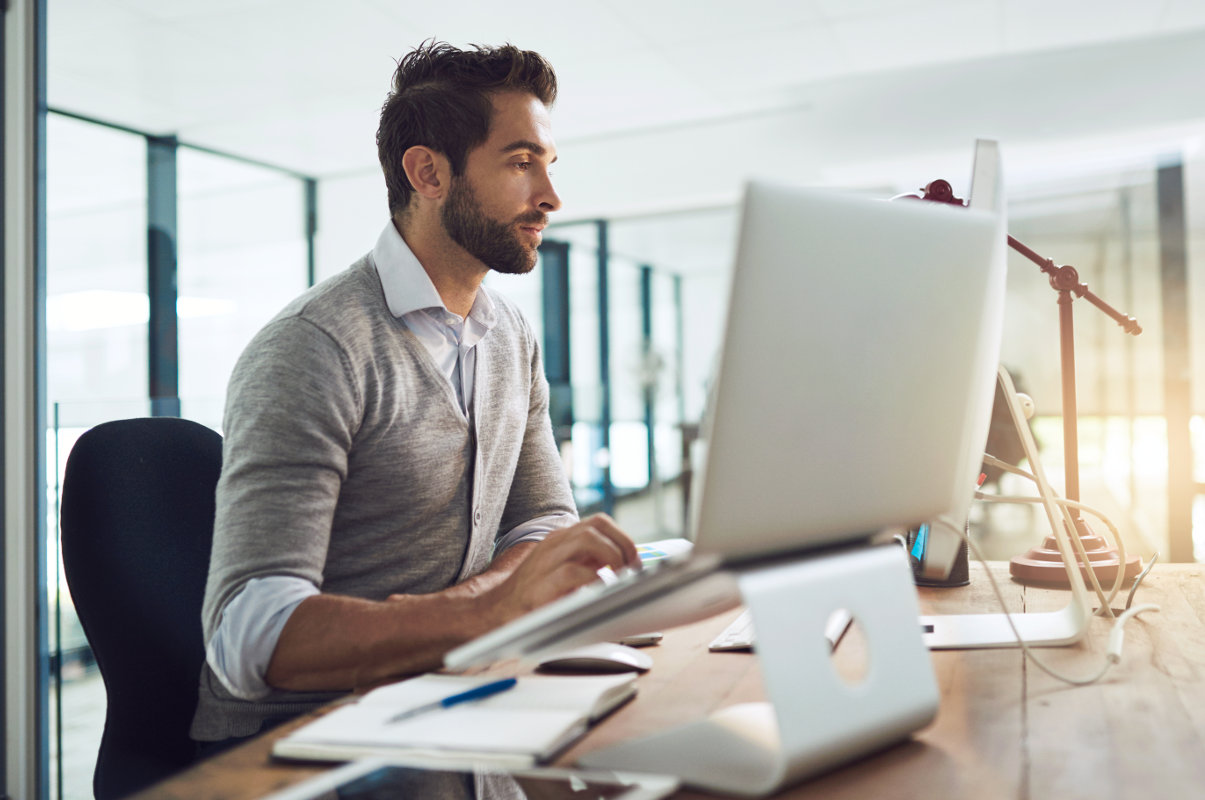 Man working at his office computer.