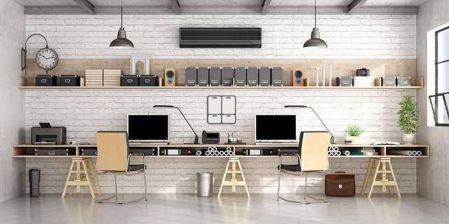 Bright office with industrial design and wide shelving.