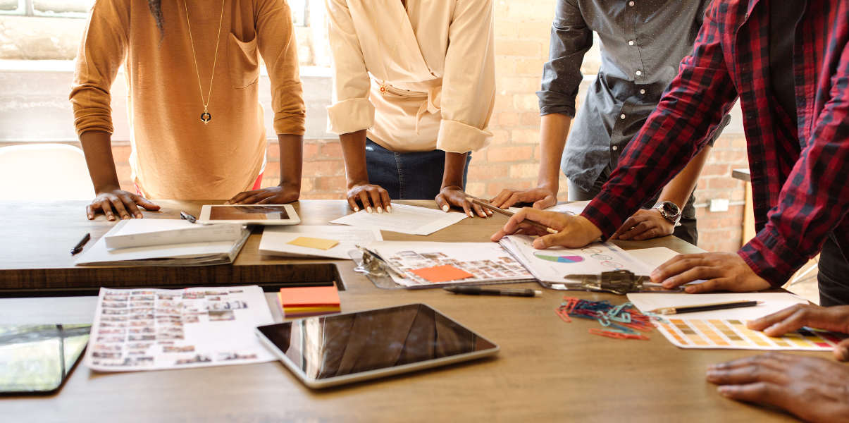 Coworkers collaborating using a large conference table